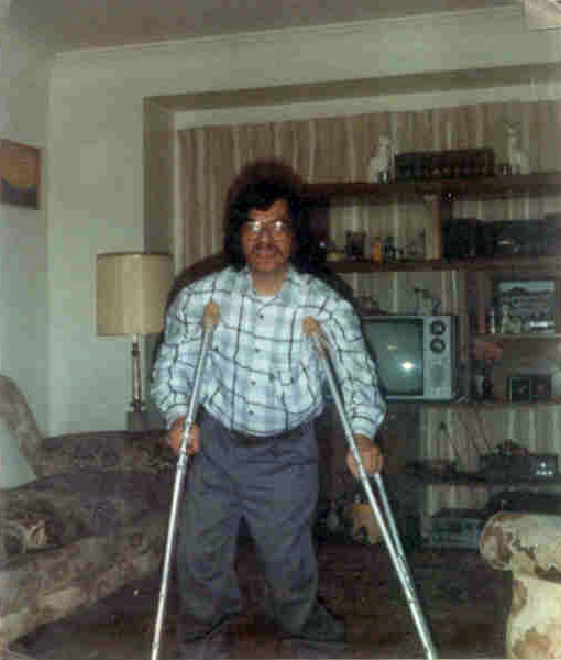 Ray in his 20s using crutches to walk